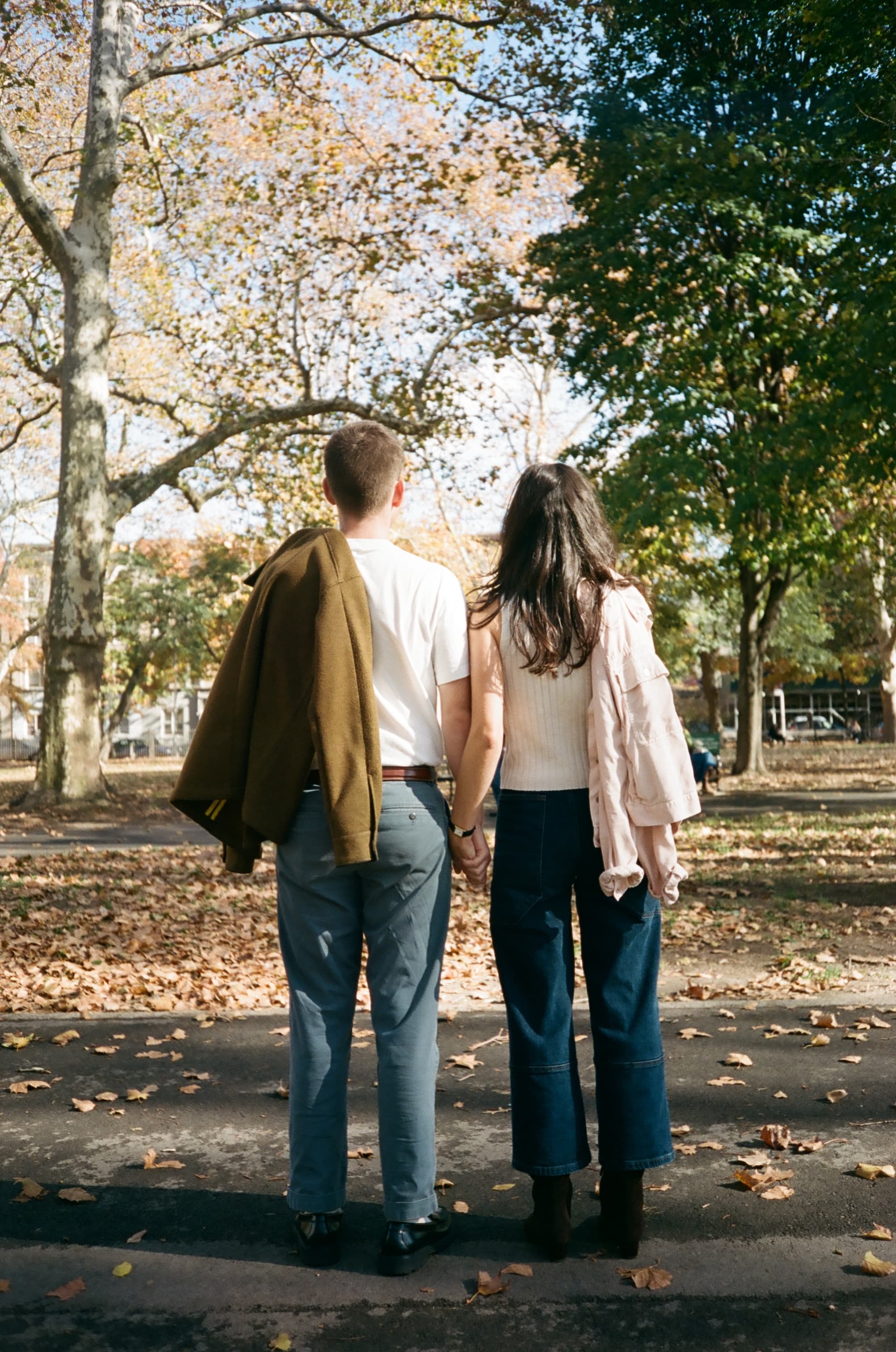 Emily and Will walking away holding hands