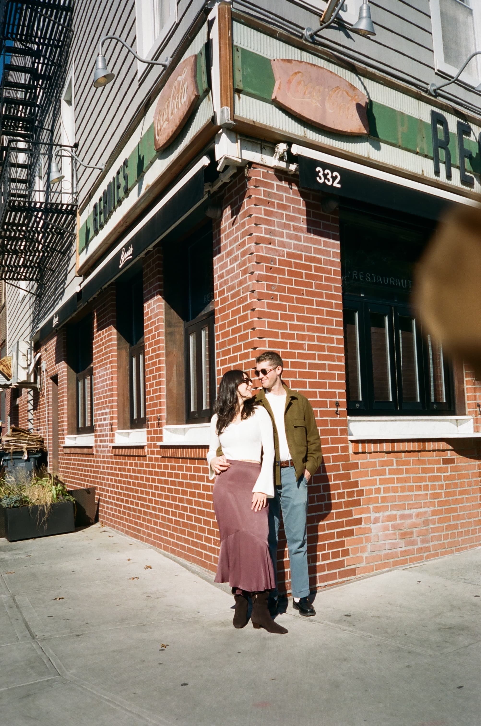 Emily and Will kissing outside Bernie's restaurant